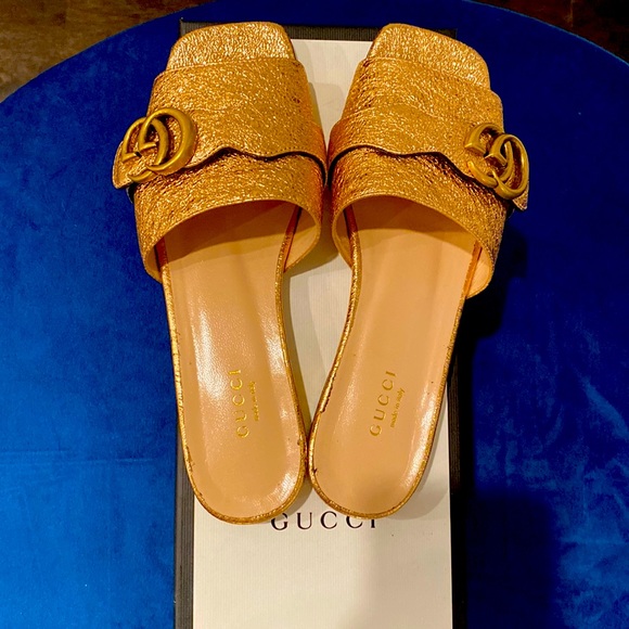 Gucci Shoes - Gucci logo gold slides to compliment any outfit. Looks brand new from front